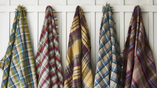 Picnic rugs hanging up, from our spring and summer 2025 range